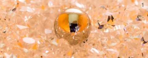 A single Micromagnet sphere resting on faceted crystals